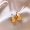 Pendientes Dorados Brillantes con Forma de Gota de Agua Estilo 2026 para Mujer, Lujo Ligero, Gama Alta, Pendientes Versátiles, Pendientes de Nicho