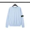 Clásico transfronterizo STONE piedra color sólido cuello redondo insignia suéter de manga larga para hombre y mujer parejas de isla versión correcta