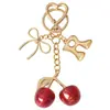 Llavero de 26 Letras de Comercio Exterior Transfronterizo con Estilo Creativo Lindo Personalizado Lazo Colgante de Cereza Portallaves de Coche