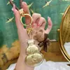 Bendición del Oficial Celestial Oro Puro 999 Llavero Calabaza para Teléfono Móvil Concha de Agua Mismo Estilo Adornos Dorados Pequeños Regalos Fabricante Venta al por Mayor