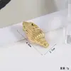 Pinza para el pelo de diseño europeo y americano imitación estrella de mar para mujer, a la moda, único, simple, pasador estilo Ins, accesorio para el pelo versátil de nicho, venta al por mayor