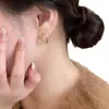 Pendientes de Nudo de Cuerda Dorada 2026 para Mujer, Diseño de Nicho de Lujo Ligero, Temperamento Único de Gama Alta, Clips para Orejas Únicos, Nuevos Pendientes al Por Mayor
