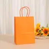 Bolsa de papel kraft blanco para llevar al por mayor color bolsa de papel con asa de cuerda bolsa para empaque de regalos de ropa de repostería