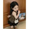 Ropa Infantil Estilo Coreano 2026 Verano Nuevo Conjunto para Niñas Chaleco Elegante con Estampado de Leopardo Falda Negra de Pastel para Niños Conjunto de Dos Piezas