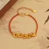 Pulseira de Fio Vermelho com Moeda Triturada para Mulheres, Moda Única Novo Estilo Chinês Design Vazado, Joia de Luxo Leve com Temperamento de Nicho