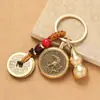Llavero de latón Wu, dios de la riqueza, transferencia de dinero, cobre puro, cinco emperadores, dios de la riqueza, llave de transferencia, colgante, venta al por mayor, lugar escénico, pequeño regalo