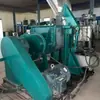 Máquina Amasadora Usada de 100L Calentamiento a Vapor Cilindro de Volteo Hidráulico Tapa de Volteo Descarga por Tornillo Máquina Amasadora