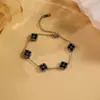 Pulsera Popular Transfronteriza de Diamante con Forma de Trébol de Cuatro Hojas Acero Inoxidable Lujo Ligero Moda de Gama Alta Doble Cara Joyería de Nácar Venta al por Mayor