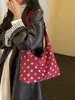 Bolsa casual de lunares de alta calidad para mujer 2026 nueva bolsa de mano de gran capacidad versátil para ir al trabajo bolsa de un solo hombro para el antebrazo