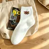 Calcetines de felpa hasta la pantorrilla con bordado de animal de felpa, suaves y amigables con la piel, adecuados para el uso diario, calcetines lindos y de moda para niñas