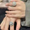 Anillo de plata con circón de perla blanca radiante de temperamento coreano, anillo de dedo índice ligero de lujo, exquisito, de alta calidad, para mujer socialité