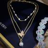 Conjunto de tres piezas de collar Dongdaemun de Corea del Sur para mujer, cadena de clavícula con temperamento desmontable y perlas de mariposa