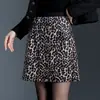 Falda retro americana con estampado de leopardo para mujer, nuevo estilo otoño e invierno 2026, estilo chica picante, de cintura alta, anti-exposición, mini falda bodycon de línea A