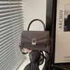 Bolso de mano texturizado con estampado de lichi estilo coreano, nuevo bolso cruzado y de hombro casual retro de moda 2026 para mujer