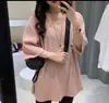 Camiseta Feminina de Verão Chiba Plissada Grande Manga Curta Dividida Pulôver Estilo Preguiçoso Cor Sólida Estilo Coreano