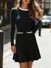 Vestido de punto estilo Chanel transfronterizo 2026 para mujer, cuello redondo con bloques de color, manga larga, decoración de bolsillo, minifalda plisada entallada a la cintura