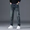 Jeans masculinos de Hong Kong 2026 primavera novo lavagem vintage reto corte slim moderno elástico casual calça comprida