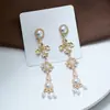 Pendientes largos de plata de ley s925 con forma de aguja y estilo vintage de Qingdao Jewelry, con clip para las orejas y perlas barrocas francesas.