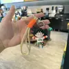 Llavero de Monos de Sol de Dibujos Animados Nuevo Producto Transfronterizo Periférico de Anime Muñeco de Plástico Blando Colgante para Pareja Coche Bolsa Regalo