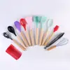 Juego de utensilios de cocina de silicona personalizados para uso doméstico, mango de madera acero inoxidable integrado silicona antiadherente sartén espátula especial juego