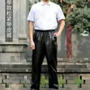 Pantalones de cuero aceitado overol de cuero para hombre a prueba de viento matadero japonés anti-suelto a prueba de salpicaduras de cuero todo partido Hong Kong otoño e invierno