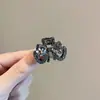 Elegante mini grampo de garra com laço de cristal preto gunmetal para mulheres, adequado para penteados semi-presos, franjas e franja lateral