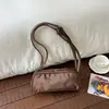 Bolsa de Bolos de Mano para Mujer 2026 Nuevo Super Caliente Bloqueo de Color Sensación de Alta Gama Hombro Único Viaje al Trabajo Debajo del Brazo Bolso de Hombro Único