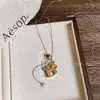 Planeta de Mascotas Lindas~ Collar de Oso Perro de Madera para Mujer, Accesorio de Cadena para Suéter con Diseño Lindo de Nicho Otoño e Invierno