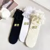 Calcetines de encaje transpirables cómodos para niñas de primavera y verano, calcetines de encaje versátiles suaves y lindos para niños, calcetines altos para niños