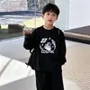 Camiseta de manga larga de algodón puro para niños, nuevo estilo primavera y otoño 2026, camisa holgada y elegante para niños pequeños, top de dibujos animados para niños mayores