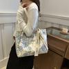 Bolso de mano estético para axilas para mujer, nuevo bolso de hombro artístico de nicho 2024, bolso de viaje informal para estudiantes de moda.