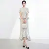 Conjunto de moda de alta gama para mujer Miyake: elegante camiseta de manga corta de lunares y falda irregular de cola de pez, elegante conjunto de dos piezas