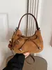 Bolso transfronterizo, diseño minimalista y único, bolso de hombro con lazo, versátil para el trabajo, bolso cruzado y un bolso de mano elegante