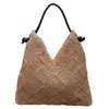 Bolsa de playa de alta gama para mujer, nuevo estilo 2026, con un diseño tejido hueco, gran capacidad y estilo de bolso tote de paja