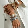 Europa y Estados Unidos joyería transfronteriza moda perla pulsera de rebote multicapa aleación de alto nivel Traje de pulseras nuevo