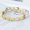 Pulsera sencilla de moda europea y americana transfronteriza de acero de titanio con forma de herradura a cuadros hueca pulsera de acero inoxidable para damas al por mayor