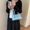 Bolso de Mano Pequeño Versátil de Gama Alta Estilo Coreano para Mujer 2026 Nuevo Súper Caliente Textura Retro Bolso Cruzado Tipo Cubo