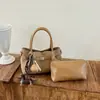 Bolso modelo nuevo 2026 transfronterizo, bolso de mano simple estilo coreano, bolso tipo cubo de moda de gran capacidad, bolso cruzado casual para el día a día
