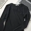 Camiseta versátil de manga larga de algodón 95% de color liso, corte ajustado para mujer, para otoño e invierno, adelgazante, entallada, cuello redondo, camiseta básica