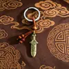 Estilo étnico chino joyería aleación espada de siete estrellas decoración pequeño regalo llavero colgante adorno colgante accesorios metálicos venta al por mayor