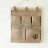 Versão coreana de tecido simples de algodão e linho pendurando saco pendurado impermeável PE porta de filme para trás multi-camada de armazenamento pendurado bolso atacado