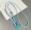 Cordón para teléfono con clip ajustable para llevar cruzado o al cuello, diseño tres en uno con colgante de caricatura, anti-pérdida, duradero y moderno
