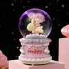 Cartón tarjeta cuero delfín de agua niño bola de cristal brillante caja de música escritorio adornos lindos waterpolo regalos al por mayor