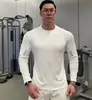 Jaqueta esportiva sem capuz de novo estilo para homens, com mangas compridas elásticas de secagem rápida, adequada para corrida, treino e fitness, com gola alta e corte justo.