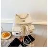Mochila de alta calidad estilo Chanel para mujer, modelo nuevo 2026 en patrón de diamante rosa, versátil con múltiples bolsillos y asa de cadena