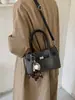 Bolso modelo nuevo 2026 transfronterizo, bolso de mano simple estilo coreano, bolso tipo cubo de moda de gran capacidad, bolso cruzado casual para el día a día