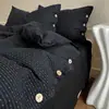 Nuevo conjunto de cuatro piezas de algodón y lino estilo botón simple de lujo ligero, estilo minimalista de Instagram, conjunto de tres piezas de hilo de rizo de algodón puro para ventas transfronterizas