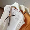 Bufanda de Seda Elegante Estilo Coreano Transfronteriza Crochet con Cordones Top de Punto Hueco para Mujer, Nuevo Verano Delgado Sin Mangas con Diseño Juvenil y Elegante