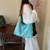 Bolso tote de lona casual de gran capacidad estilo coreano para mujer, nuevo bolso de hombro y cruzado versátil bordado con letras