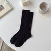Calcetines de lana para mujer otoño e invierno calcetines gruesos cálidos de cachemira calcetines de invierno para mujer de media pantorrilla de color sólido calcetines de felpa calcetines de moda